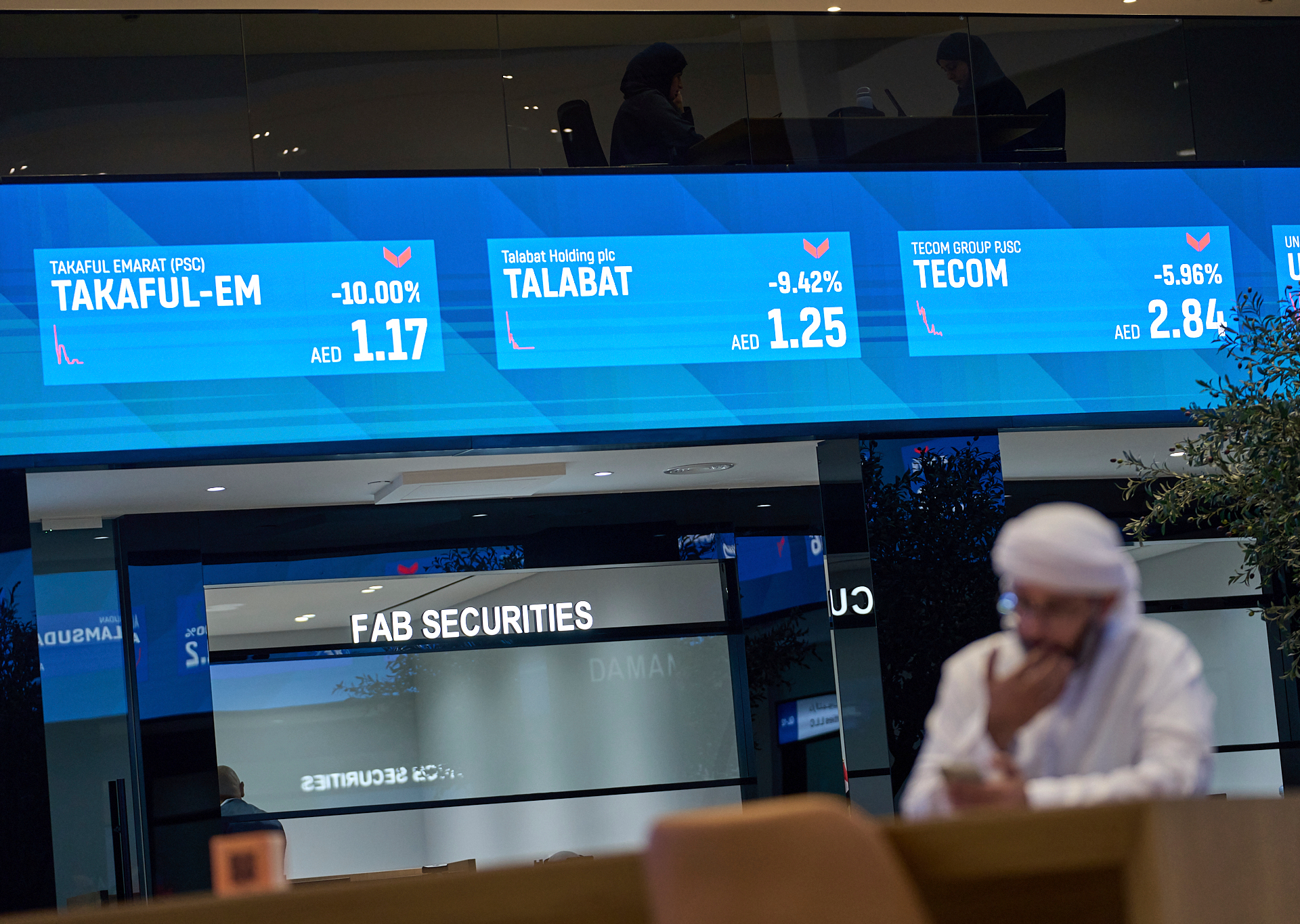 Exchange trading board representing CMA regulation of licensed markets