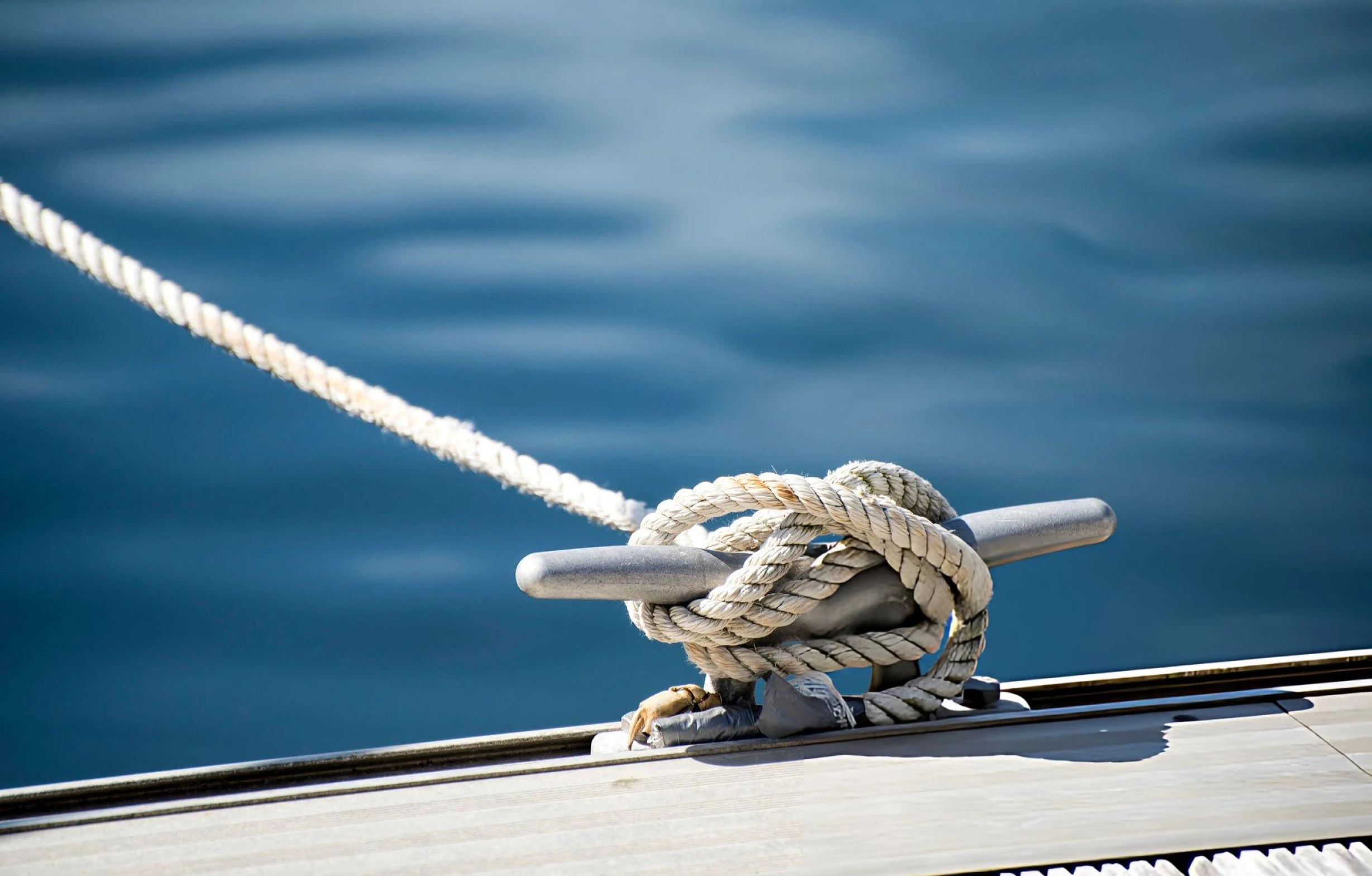 Rope boundary across sand representing the reach of VARA marketing rules into the UAE